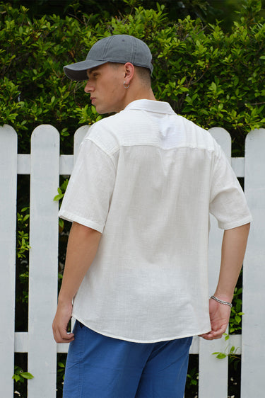 Oversized California Oranges shirt by Bonkerscorner UAE featuring colorful orange print and relaxed fit, displayed on a hanger.