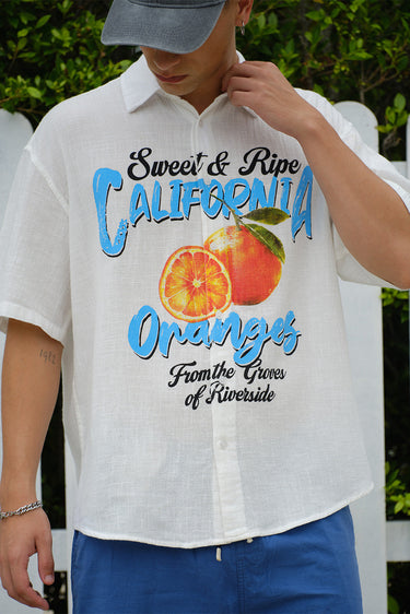 Oversized California Oranges shirt by Bonkerscorner UAE showing colorful orange and white striped fabric on a casual fit top.