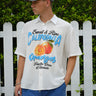 Oversized California Oranges shirt by Bonkerscorner UAE featuring vibrant orange and white stripe pattern on soft fabric.