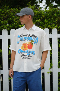 Oversized California Oranges shirt by Bonkerscorner UAE featuring vibrant orange and white stripe pattern on soft fabric.