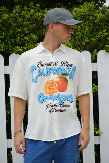 Oversized California Oranges shirt by Bonkerscorner UAE featuring colorful orange fruit print on soft fabric.