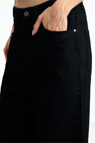 Jet black relaxed fit jeans by Bonkerscorner UAE, displayed on a hanger with visible stitching and classic five-pocket design.