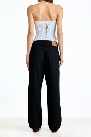 Jet black relaxed fit jeans by Bonkerscorner UAE displayed on a hanger, showcasing the casual, comfortable style and fabric texture.