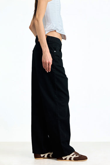 Jet black relaxed fit jeans from Bonkerscorner UAE displayed on a model, showcasing a casual, comfortable style.