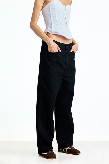Jet black relaxed fit jeans by Bonkerscorner UAE, showing the denim fabric and casual style on a model.