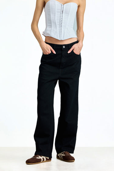 Jet black relaxed fit jeans by Bonkerscorner UAE displayed on a model, featuring a casual style and classic denim design.