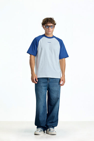 Oversized varsity raglan T-shirt by Bonkerscorner UAE featuring bold color-block design and relaxed fit, front view.