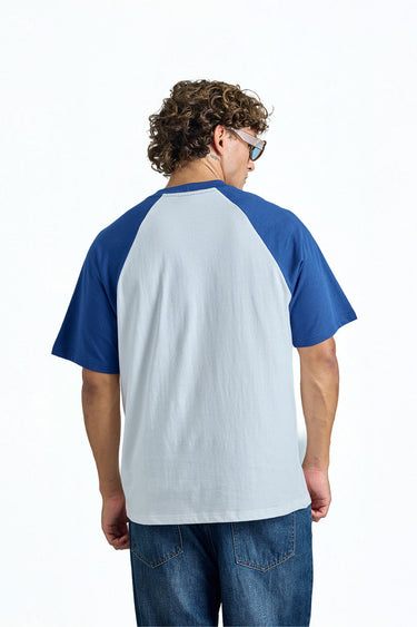 Bonkerscorner UAE varsity raglan oversized T-shirt with contrasting sleeves and casual fit, displayed on a hanger.