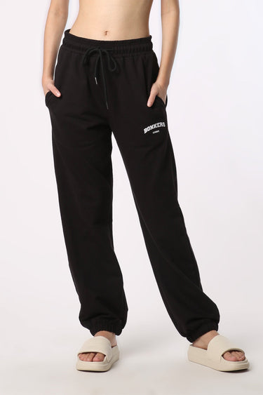 Black Bonkers Corner joggers in size XS, featuring a comfortable fit and casual style, shown on a plain background.