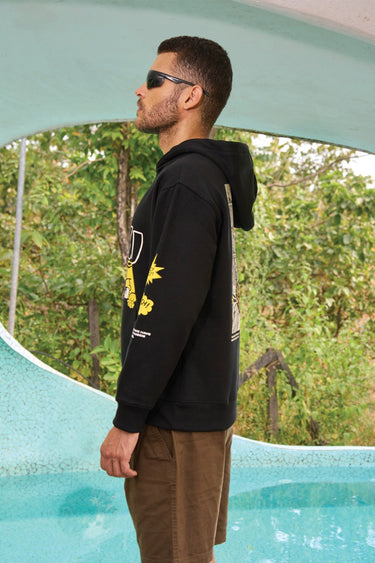 Black hoodie with "Ahoy" graphic from Bonkers Corner, featuring a casual fit and soft fabric, perfect for everyday wear.