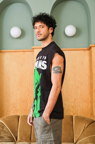Bonkers Corner oversized tank top featuring "Allergic To Humans" graphic in black on a white background, casual streetwear style.