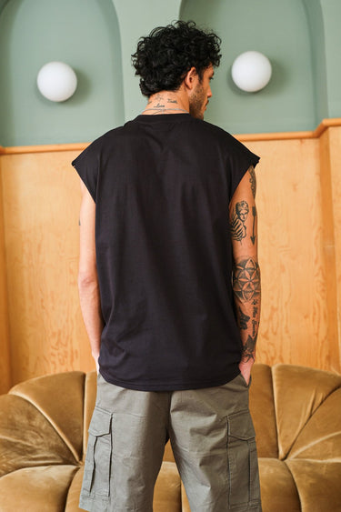 Bonkers Corner oversized tank top featuring "Allergic To Humans" graphic in a relaxed fit, casual streetwear style.