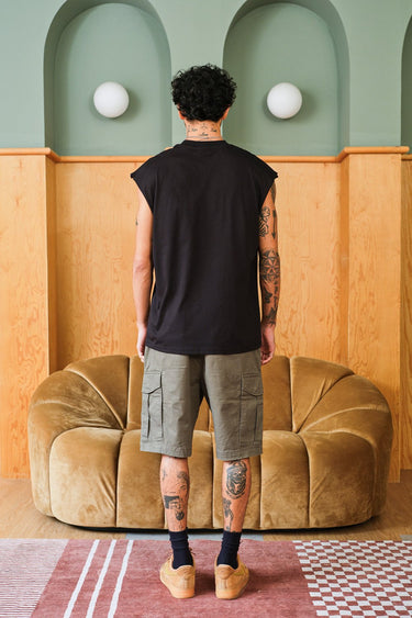 Bonkers Corner oversized tank top with "Allergic To Humans" slogan, relaxed fit, soft fabric, and casual streetwear style.