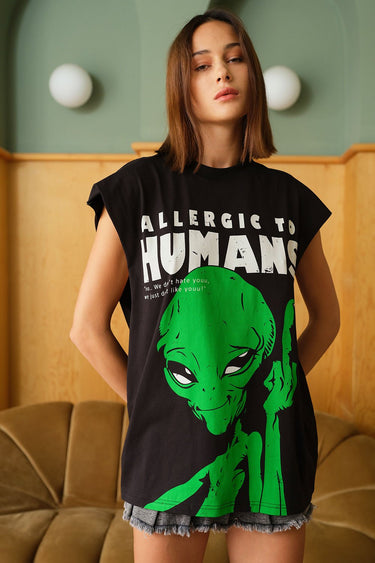 Bonkers Corner oversized tank top with "Allergic To Humans" slogan in black on white fabric, casual unisex style.