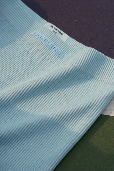 Baby blue ribbed workout shorts by Bonkers Corner, featuring a comfortable fit and stretchable fabric for active wear.