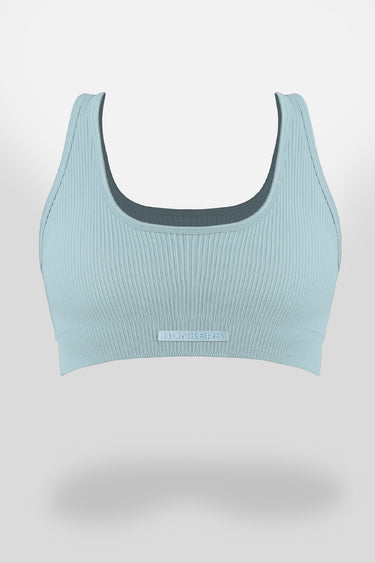 Baby blue sporty ribbed crop top by Bonkers Corner, close-up of fitted, textured fabric and cropped design.