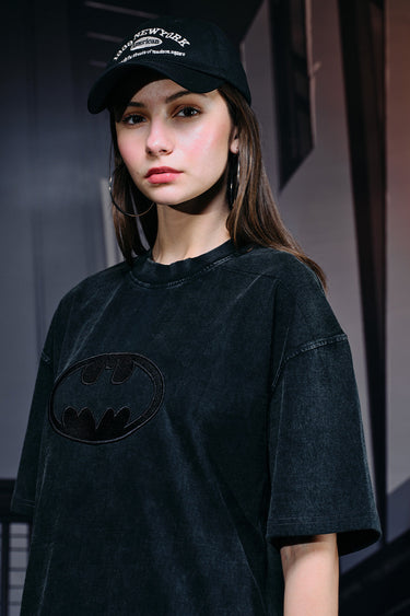 Faded black oversized T-shirt with a bat emblem design from Bonkers Corner, casual streetwear style.