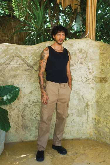 Beige cargo pants with utility pockets from Bonkers Corner, featuring multiple practical storage compartments and a relaxed fit.