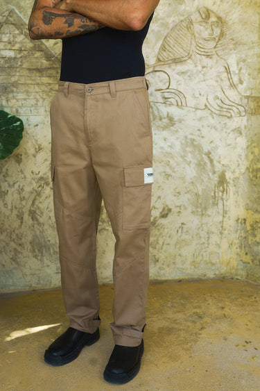Beige cargo pants with utility pockets by Bonkers Corner, featuring multiple functional pockets and a casual, relaxed fit.