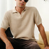 Beige knit textured polo T-shirt by Bonkers Corner, close-up showing fabric details and classic collar design.