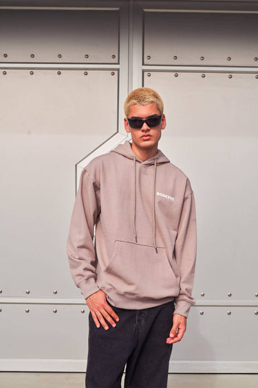 Beige limited edition hoodie by Bonkers Corner featuring a relaxed fit and subtle branding, displayed flat on a white background.