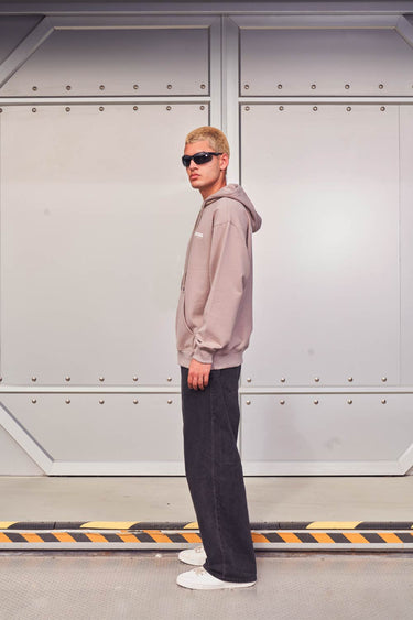 Beige Bonkers Corner Limited Edition hoodie with soft fabric and relaxed fit, front pocket, and brand logo detail.