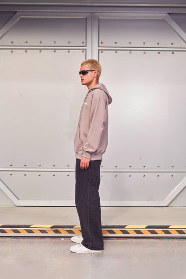 Beige limited edition hoodie by Bonkers Corner, featuring a comfortable fit and stylish design, shown on a hanger.