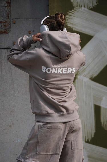 Beige limited edition hoodie from Bonkers Corner, featuring a cozy fit and stylish design, displayed on a mannequin.