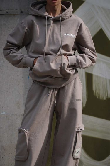 Beige limited edition hoodie by Bonkers Corner featuring a cozy fit and soft fabric, shown on a mannequin.