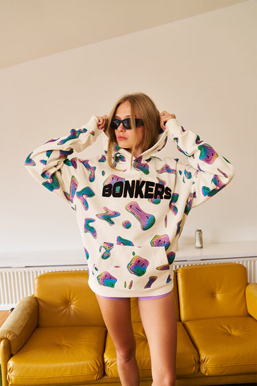 Beige Smiley Originals hoodie by Bonkers Corner featuring a relaxed fit and a playful smiley face design.