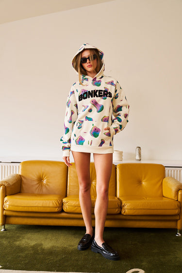 Beige Smiley Originals hoodie by Bonkers Corner featuring a cheerful smiley face graphic on the front.