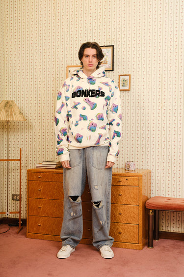 Beige Smiley Originals hoodie by Bonkers Corner featuring a relaxed fit and playful smiley graphic on the front.