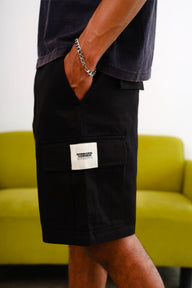 Black Authentic Utility Shorts by Bonkers Corner, showing durable fabric, multiple utility pockets, and a relaxed fit style.