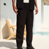 Bonkers Corner black corduroy pants, slim fit style with textured fabric, shown on a model in a casual setting