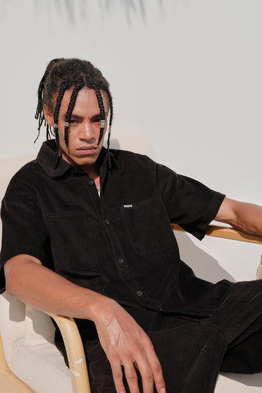 Black corduroy shirt by Bonkers Corner, featuring a classic collar and button-front design, displayed on a neutral background.