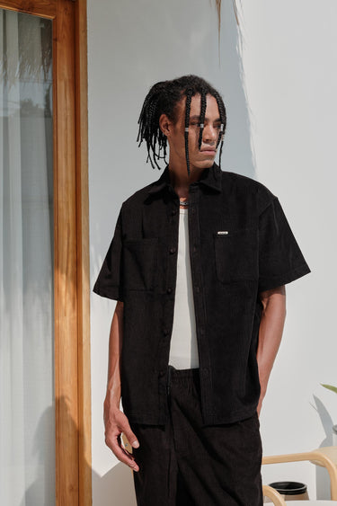Black corduroy shirt from Bonkers Corner, featuring a classic fit with a button-up front and collar.
