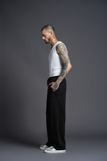 Black Bonkers Corner everyday joggers, slim-fit casual pants with elastic waistband, shown on a model.