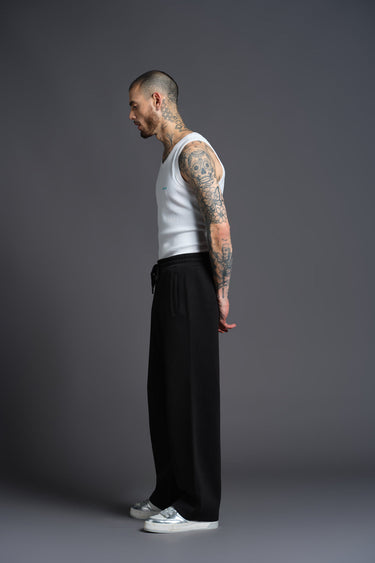 Black everyday joggers from Bonkers Corner displayed on a model, featuring a relaxed fit and casual style.