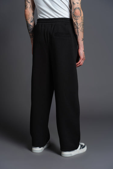 Black everyday joggers from Bonkers Corner featuring a comfortable fit and casual style, shown on a model.