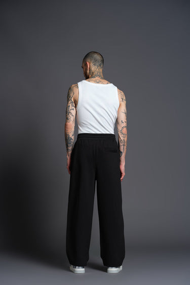 Black Bonkers Corner everyday joggers with elastic waistband and tapered fit, shown in a close-up view.