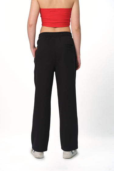 Black Bonkers Corner everyday joggers with elastic waistband and cuffs, shown on a model. Comfortable casual athletic wear.