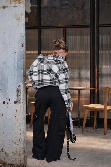 Black heavyweight cargo pants with multiple pockets by Bonkers Corner, featuring a relaxed fit and durable fabric.