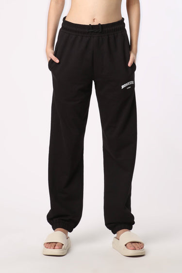 Bonkers Corner black joggers, XS size, showing relaxed fit and elastic waistband on a plain background.