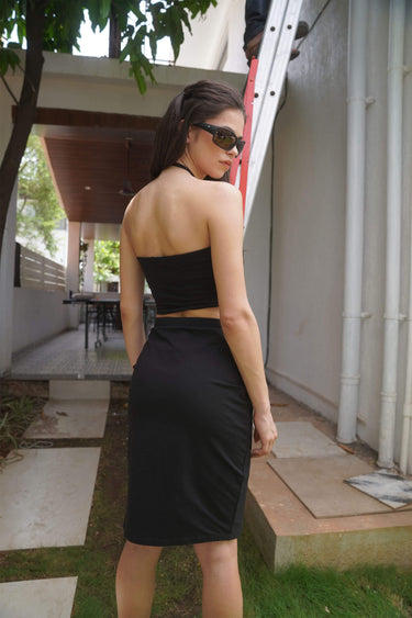 Black long slit skirt by Bonkers Corner featuring a sleek design and high slit, perfect for stylish outfit options.