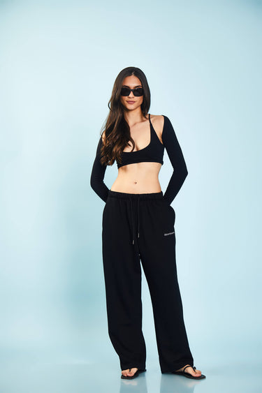 Black loose fit joggers from Bonkers Corner, featuring a relaxed style and comfortable fit, shown on a model.