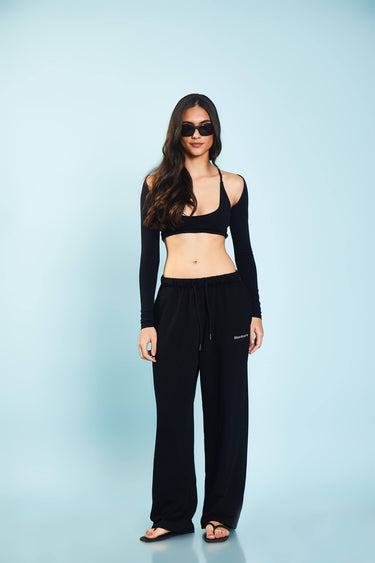 Black loose fit joggers from Bonkers Corner with elastic waistband and relaxed style, shown on a model.