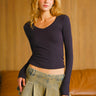 Black modal long sleeve top by Bonkers Corner, featuring a fitted design and soft fabric, shown on a white background.