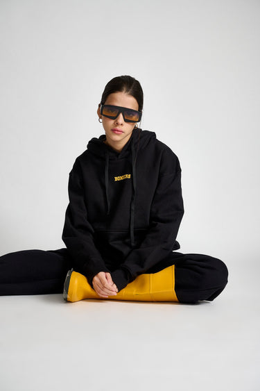 Black heavyweight fleece oversized hoodie by Bonkers Corner with signature design, shown in a relaxed fit on a model.