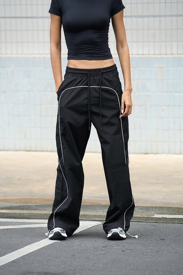 Black sporty deconstructed loose pants from Bonkers Corner with a relaxed fit and casual style.