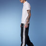 Black sporty straight fit pants by Bonkers Corner, shown in a close-up image highlighting the waistband and fabric texture.